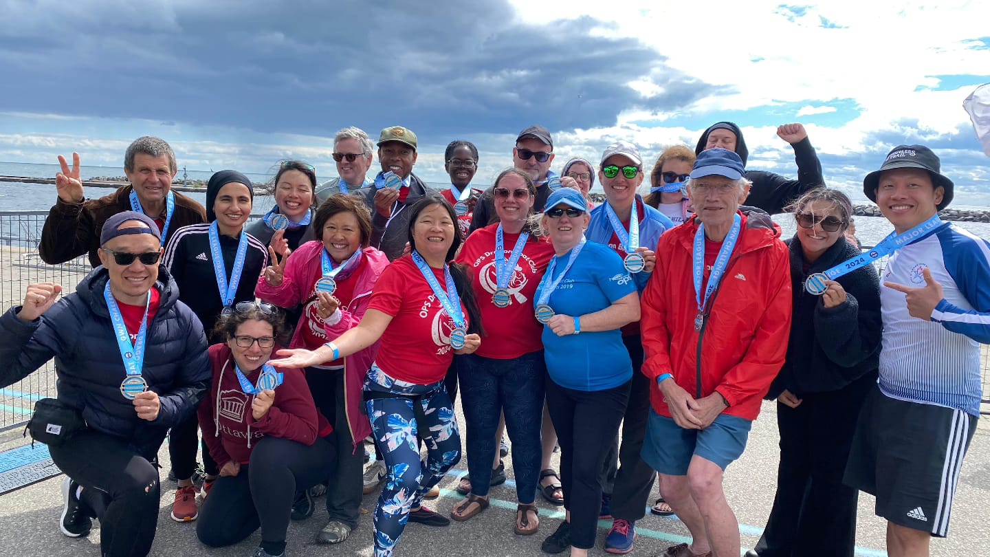 Toronto's OPS Dragon Boat team proudly showing off their medals.